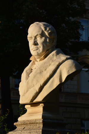 Sculpture of a man in the center of the cityの写真素材