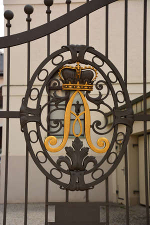 wrought-iron gatesrated with a pattern of gold, forged elementsの写真素材