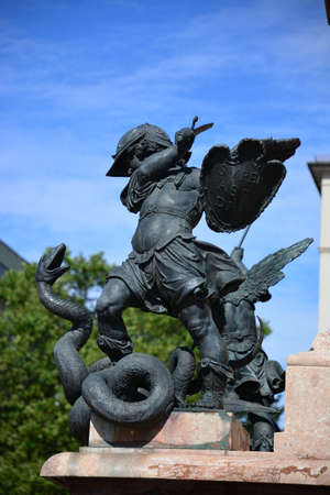 Sculpture of an angel on a fountain in the city.の写真素材