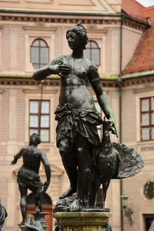 Statue of a woman in the old townの写真素材
