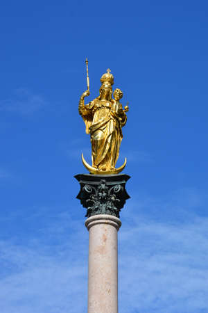 Statue of the Virgin Mary on the column of St. Peter's Square, Saint Petersburg, Russiaの写真素材