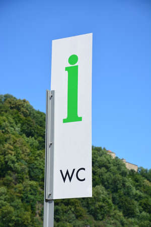 Sign for the W-C station in the center of the cityの写真素材