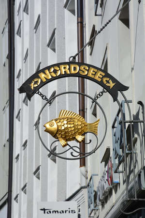 fish store sign and logo in the city centreの写真素材