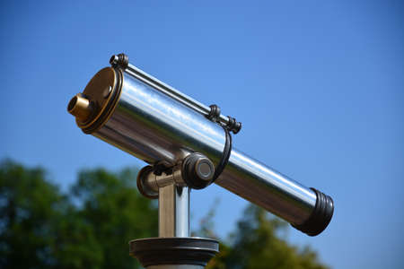 Telescope on a background of blue sky. Selective focus.の写真素材