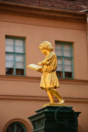 Statue of a woman reading a bookの写真素材