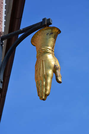 golden hand against a blue sky. High quality photoの写真素材