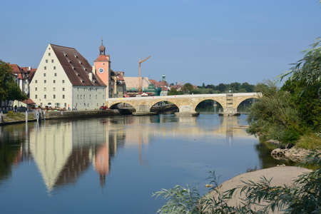 The old town of Heidelberg is reflected in the river Neckar.の写真素材