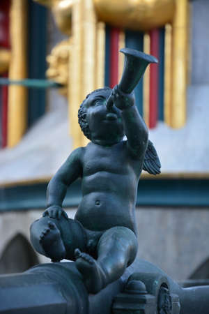 Statue of a boy playing the trumpetの写真素材