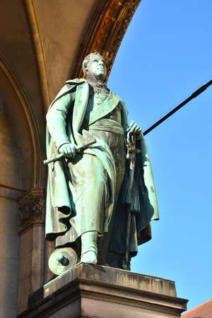 Statue of King Karl Johan in front of the Royal Palaceの写真素材