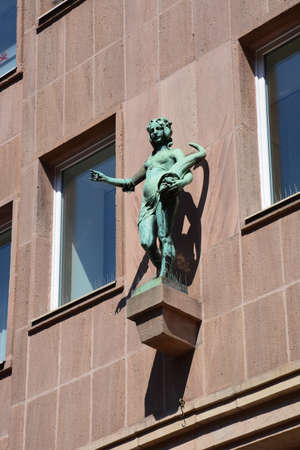 Statue on the facade of a building in the city of St. Petersburgの写真素材