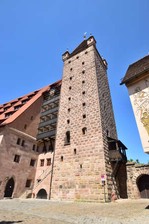 View of the medieval tower in the old town of Ruedesheimの写真素材