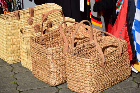 Wicker baskets for sale at a market in the old town of Riga, Latvia.の写真素材