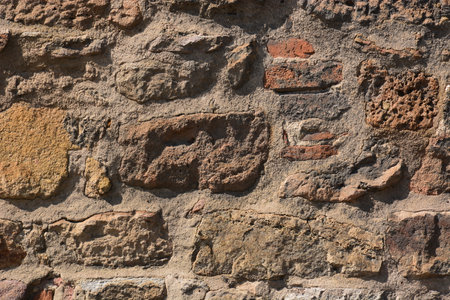 Old stone wall as a background. Texture of an old brick wallの写真素材