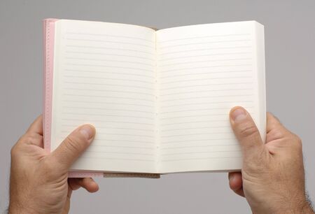 hand with notebookの写真素材