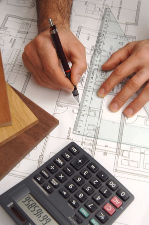 hand drawing with ruler on plans