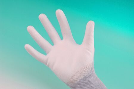 industrial glove at green background