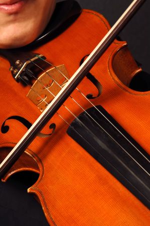 violin playing human isolated at black background             