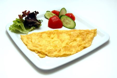 egg serve with salad for the breakfast           