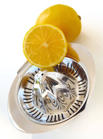 citrus and lemon squeezer isolated at white backgroundの写真素材