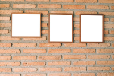blank brown picture frame on brick wallの写真素材