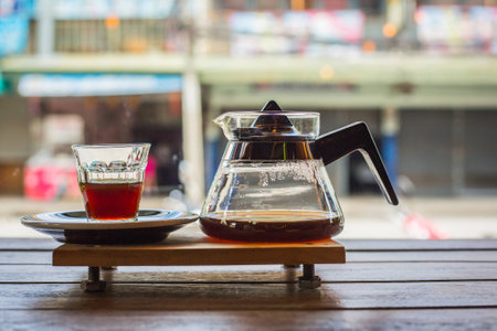 drip coffee cup and coffee pot on wood table in coffee shop.の写真素材