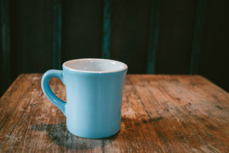 Coffee cup on wooden table background.の写真素材