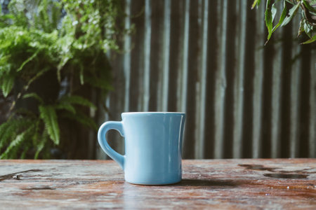 Coffee cup on wooden table background.の写真素材