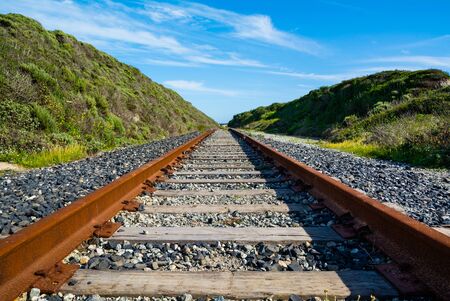 Rusty old railroad goes to horizonの写真素材