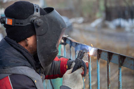Metal welding, metal fence repair.