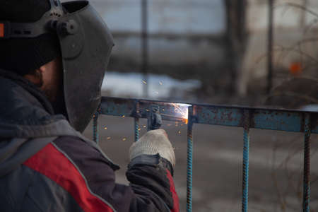Metal welding, metal fence repair.