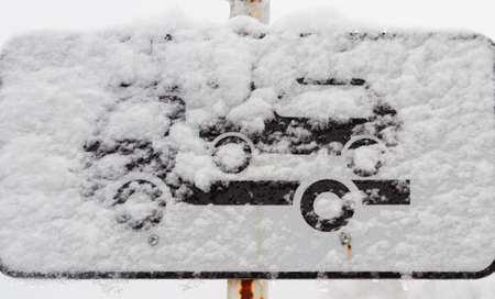 Road signs in the snow. A road sign and a blizzard. Marking and snow.の写真素材