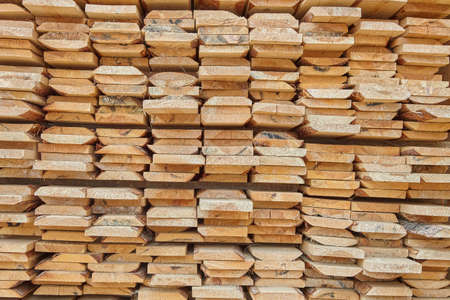 edged board in stacks. natural background. texture.の写真素材