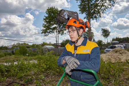 The guy works in the village against the blue sky