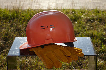 The construction helmet is white on the construction site.の写真素材