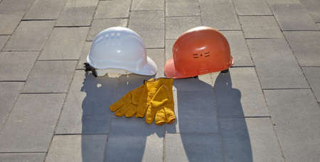 The construction helmet is white on the construction site.
