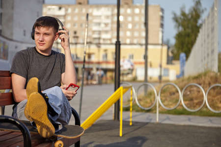 The guy is engaged on a skateboard. Skateboard in summer and student.の写真素材