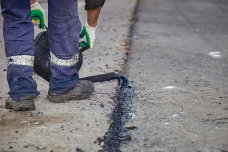 road works. Laying of new asphalt on the roadway