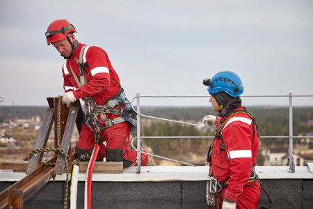 High-rise installers work with rope.