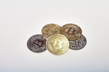 Bitcoin on a white background. Bitcoin coin on a gray background.の写真素材