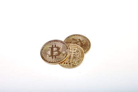 Bitcoin on a white background. Bitcoin coin on a gray background.