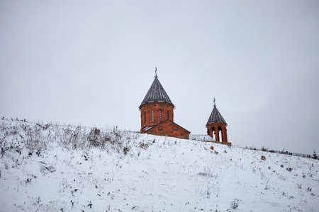 Church on a hill in the snow in winter