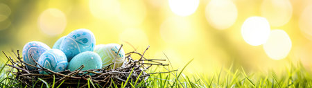 Easter eggs in the nest on green grass with bokeh backgroundの素材