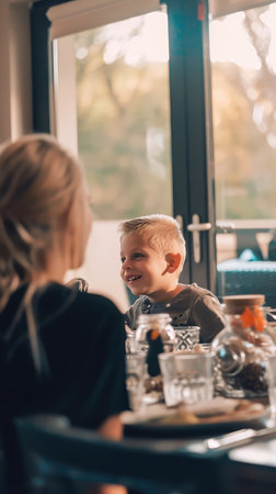 selective focus of mother and son looking at each other in cafeの素材