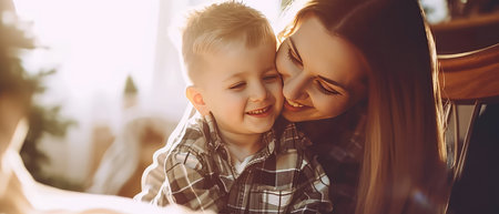 Beautiful young mother and her little son are having fun together at home.の素材
