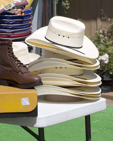 Cowboy hats stacked on table.の写真素材