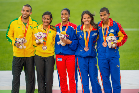 Omara Duran (center) from Cuba wins Gold Medal in the women's 100m T12 of Parapan Am Games Athletics in Toronto. Alice de Oliveira Correa from Brazil (left) wins Silver and Greilyz Villaroel from Venezuela (right) wins Bronze Medalのeditorial素材