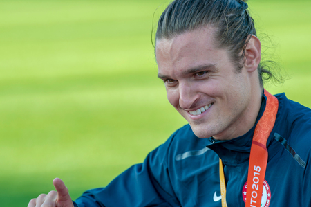 Darryd Wallace from the USA sets new World Record with 10.71 in Men's 100m T44 Final during the Toronto 2015 Parapan Am Gamesのeditorial素材