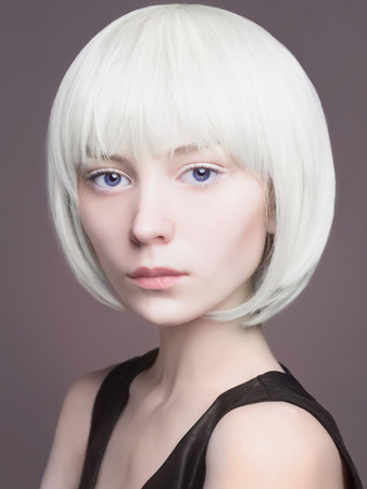 fashion portrait of beautiful blond young woman. bob hairstyle cosmic face girlの写真素材