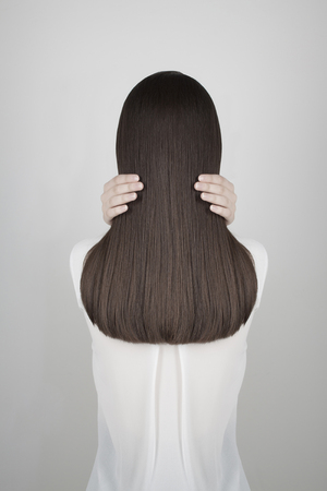 fashion photo of beautiful healthy long hair.back of brunette girlの写真素材