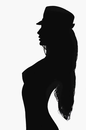 unusual studio shot of girl in hat.monochrome silhouette of young sexy body womanの写真素材